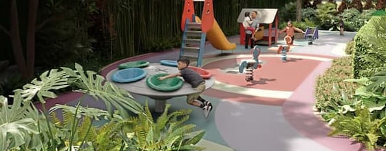Children's playground at SkySOLIS with a slide and tropical planting