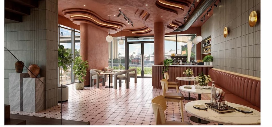 Shophouse cafe lounge at SkySOLIS with a bar counter and marble plinth
